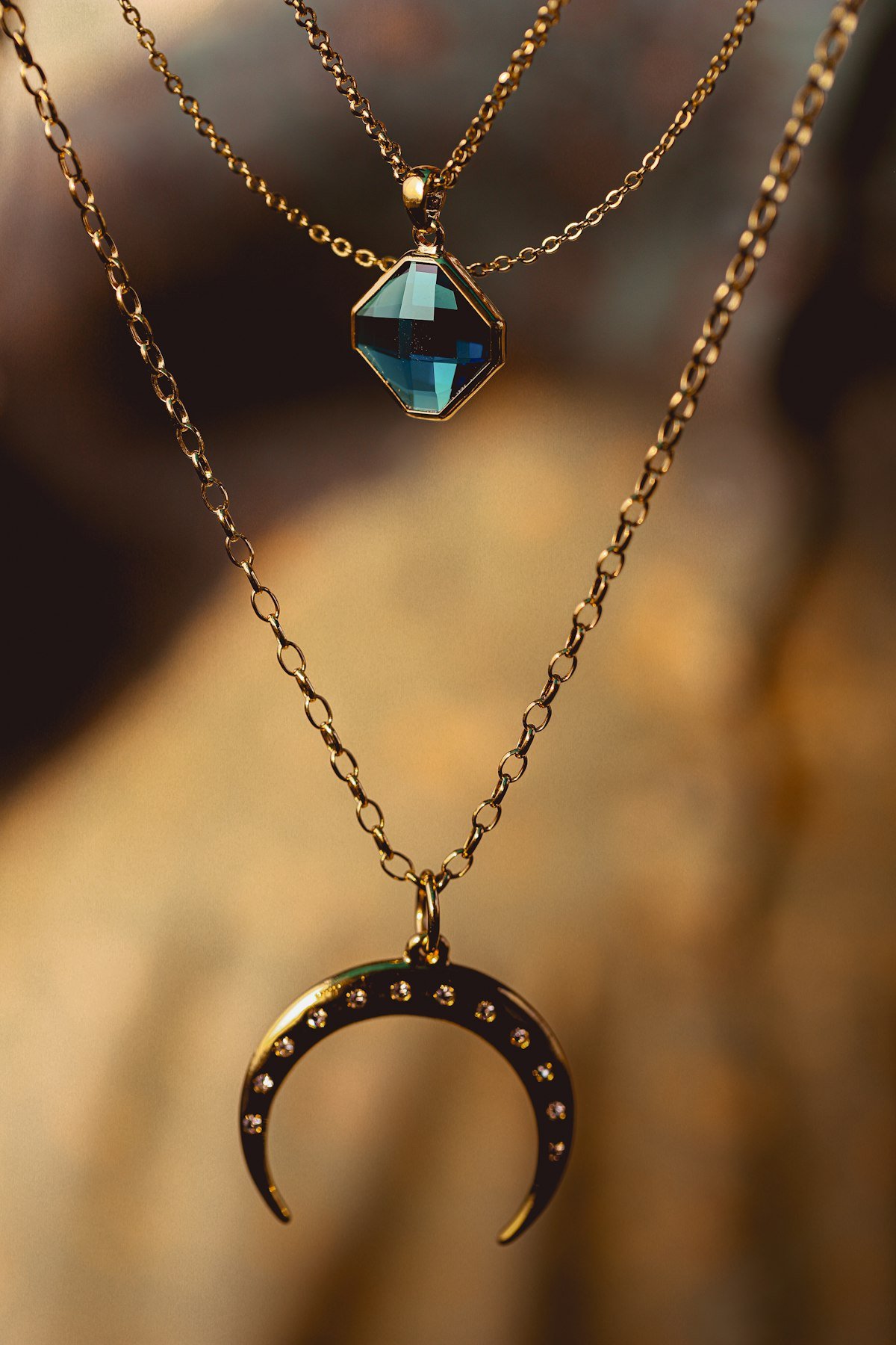 Handcrafted gold necklace on silk